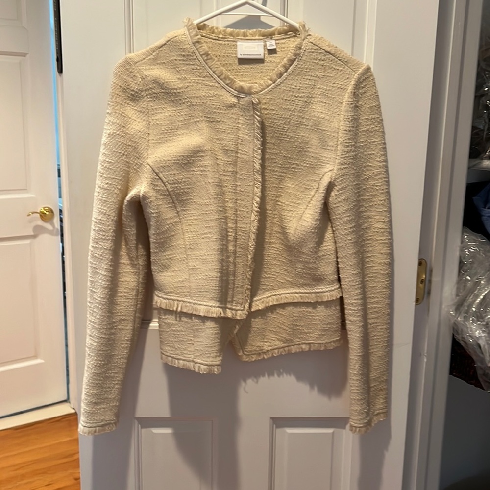 Cream colored zip jacket with hidden zip